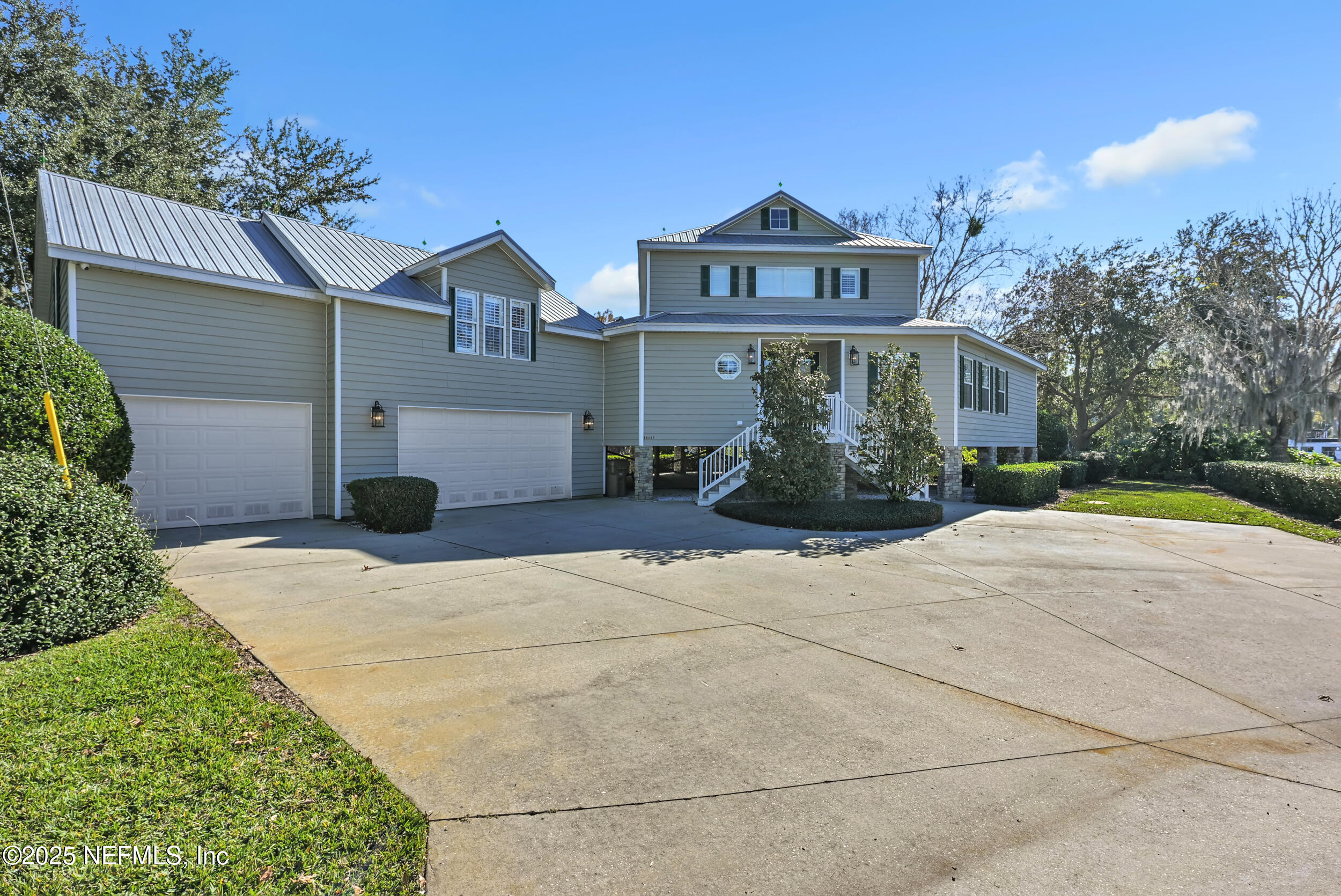 56633 Otter Road Astor, FL 32102 - Photo 2 of 69 a front view of a house with garden