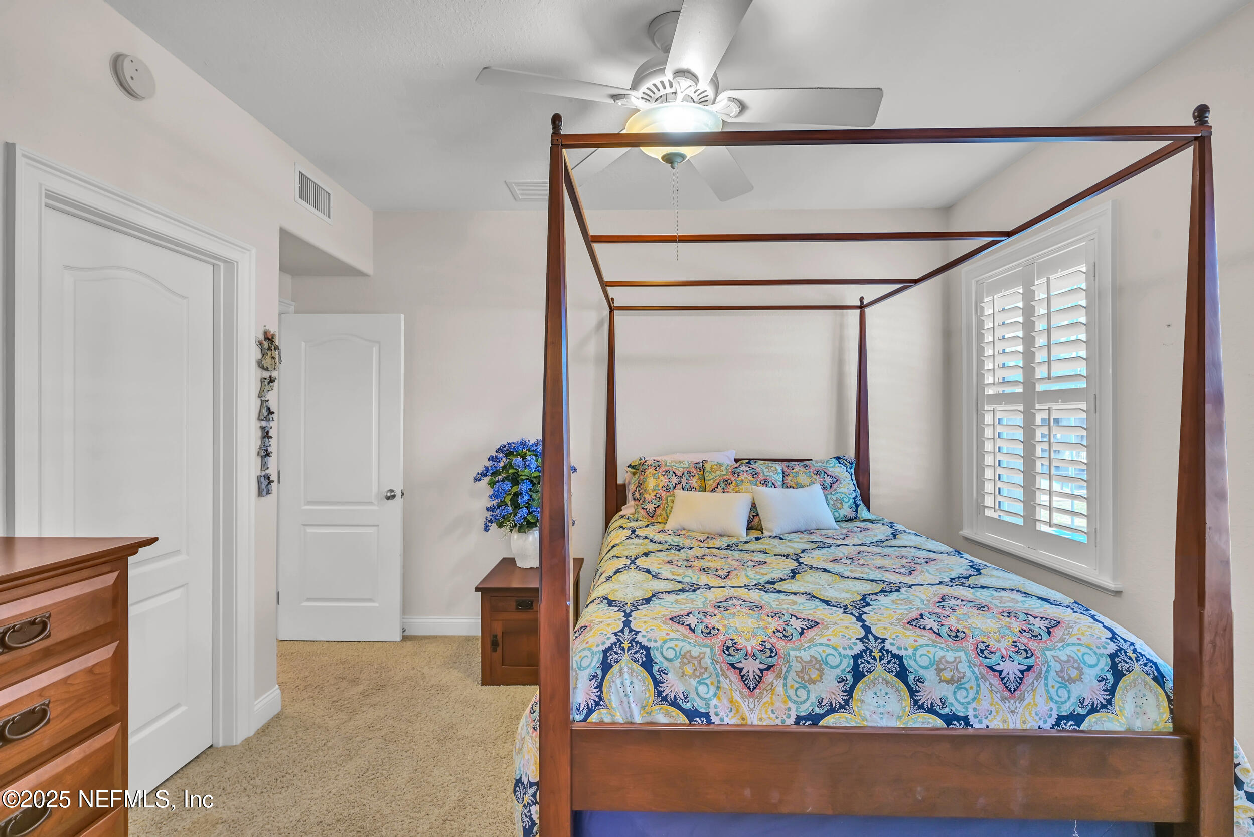 56633 Otter Road Astor, FL 32102 - Photo 28 of 69 a bedroom with a bed and a window
