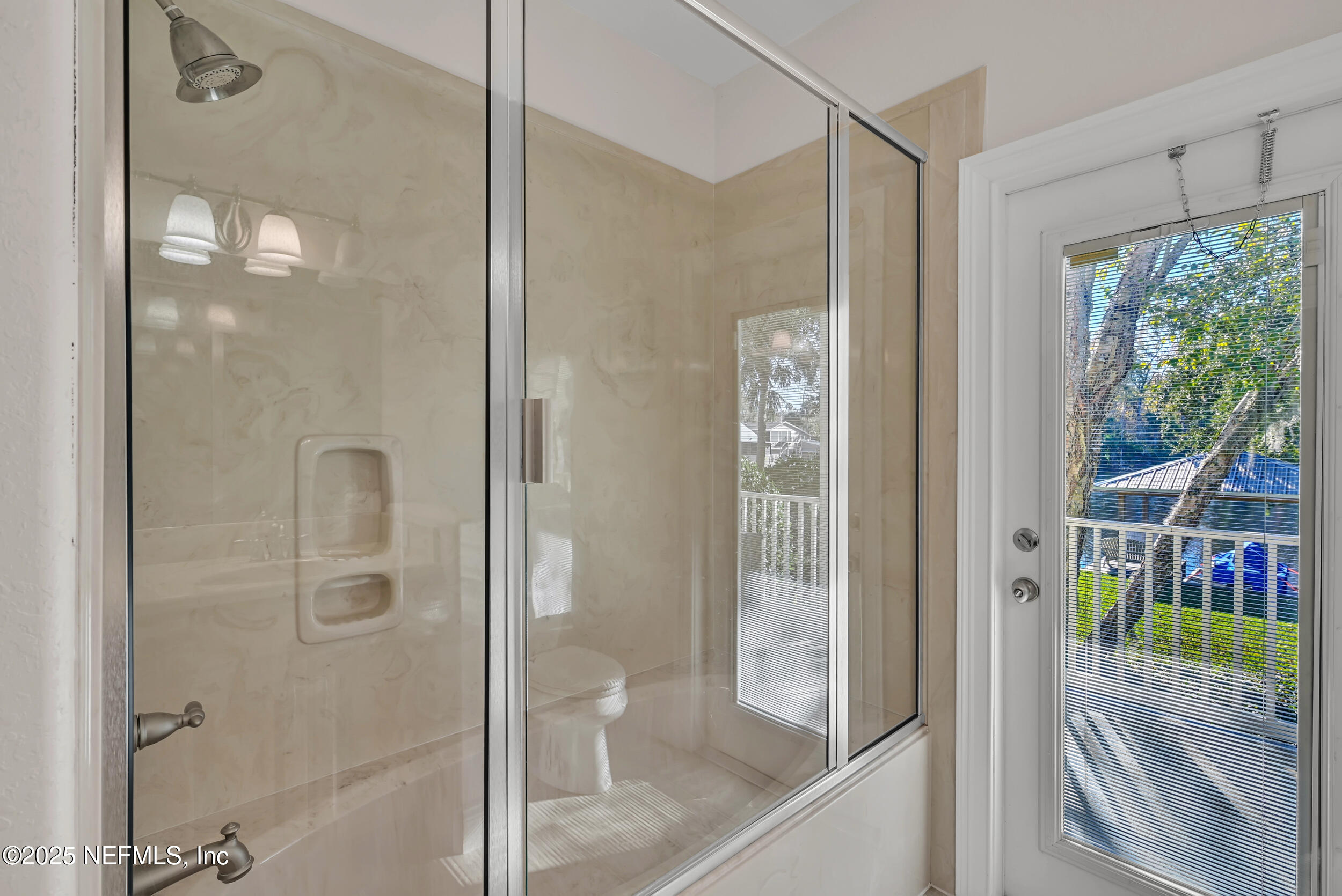 56633 Otter Road Astor, FL 32102 - Photo 31 of 69 a bathroom with a glass shower door and a sink