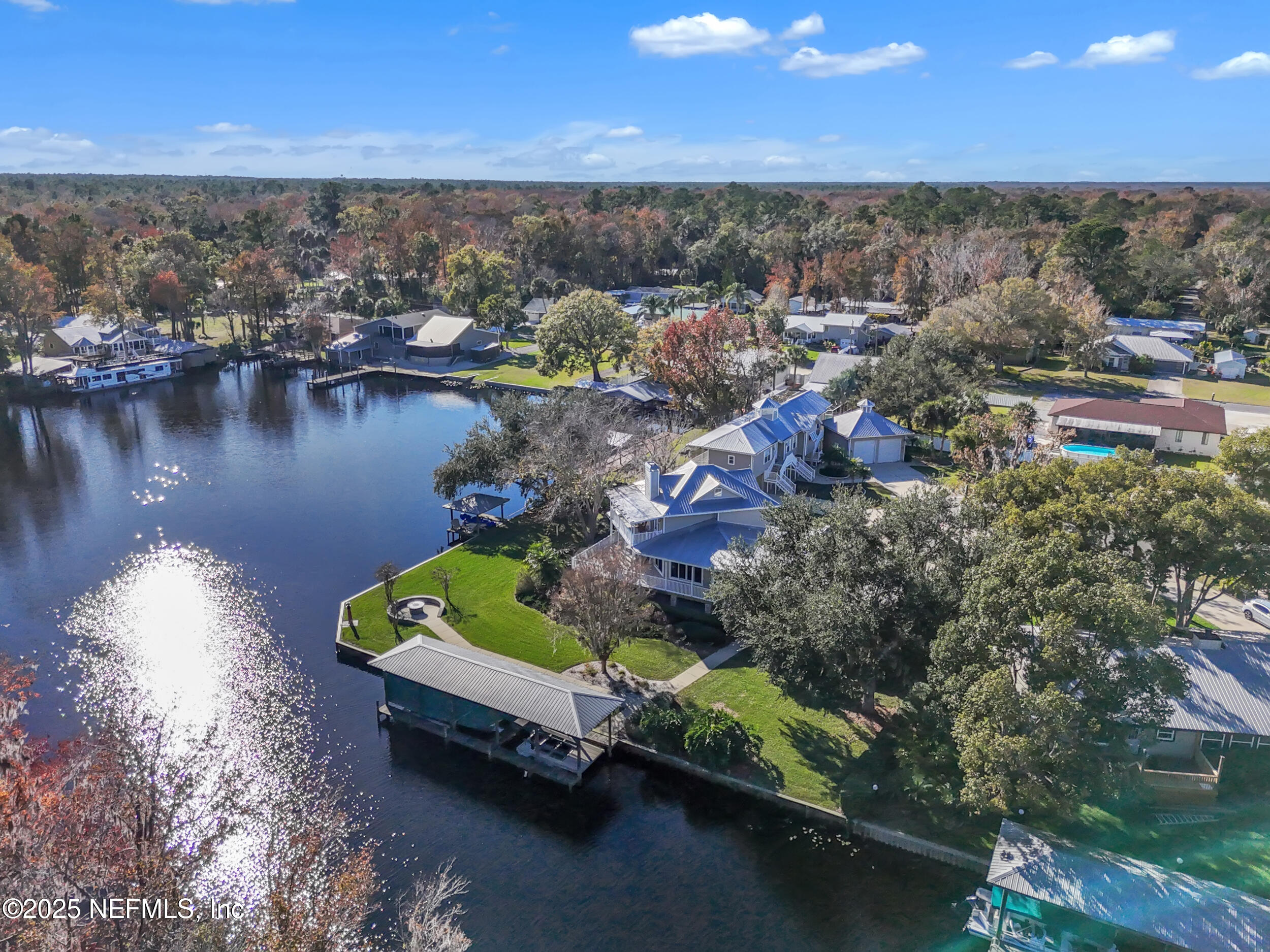 56633 Otter Road Astor, FL 32102 - Photo 36 of 69 an aerial view of a houses with a lake view