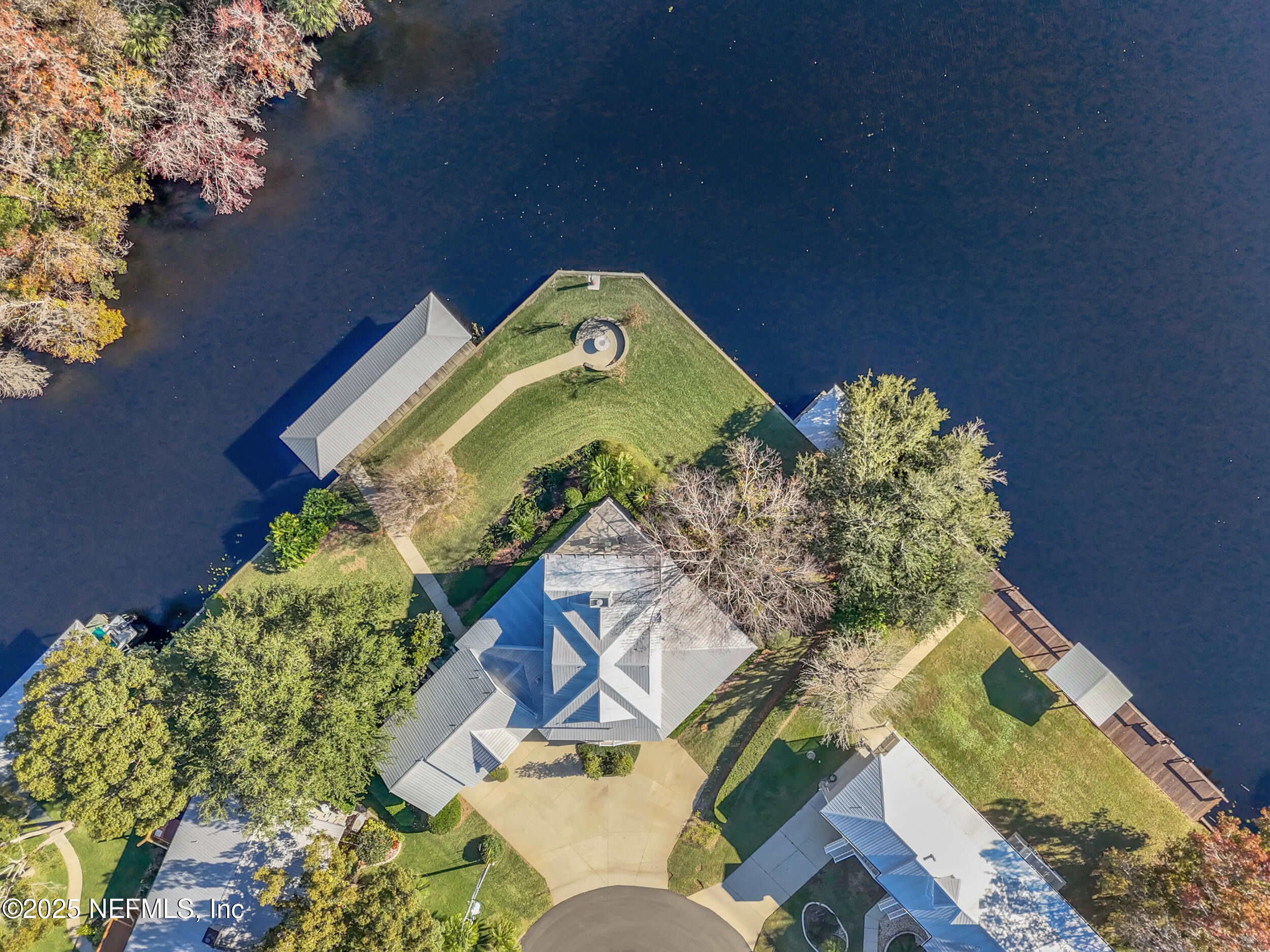 56633 Otter Road Astor, FL 32102 - Photo 38 of 69 an aerial view of a house with a yard and garden in the back