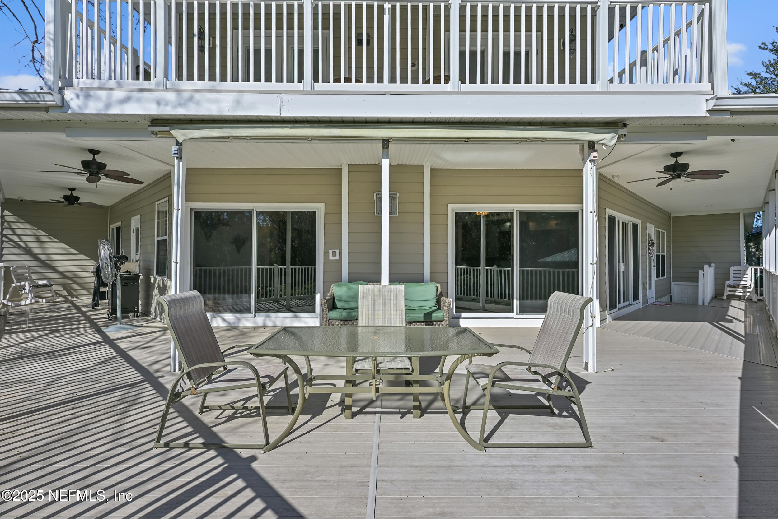 56633 Otter Road Astor, FL 32102 - Photo 44 of 69 a view of a patio with table and chairs