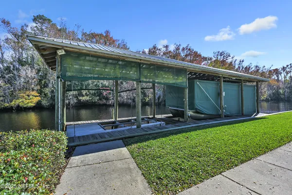 a view of a swimming pool with a table and chairs