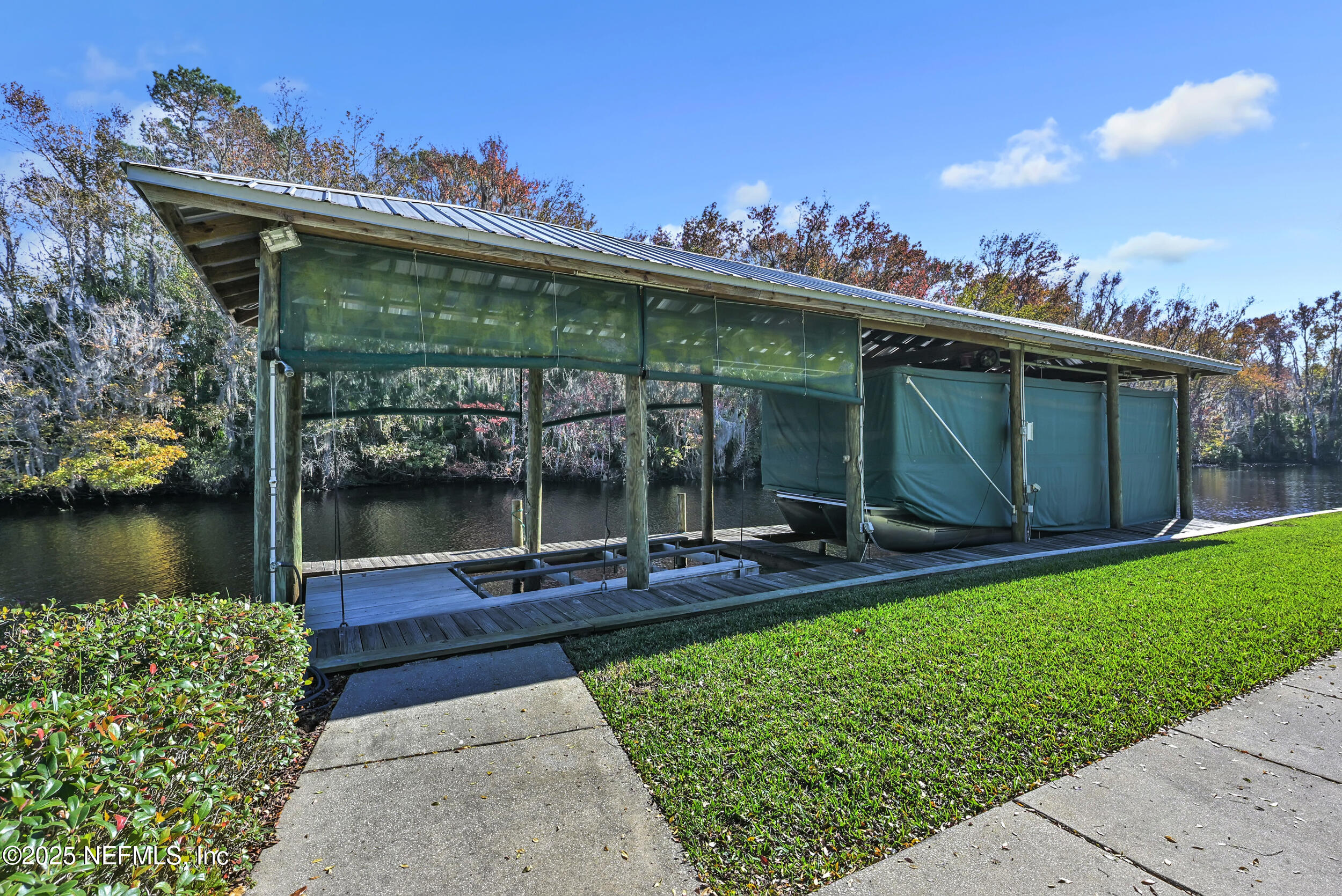 56633 Otter Road Astor, FL 32102 - Photo 50 of 69 a view of a chairs and table in the patio