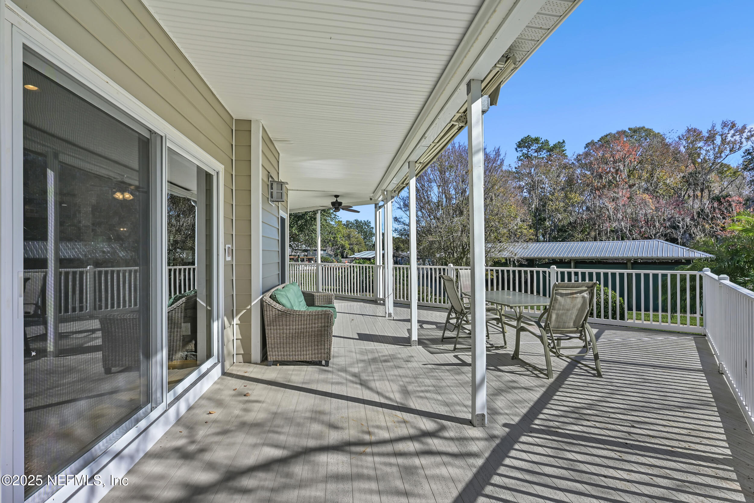 56633 Otter Road Astor, FL 32102 - Photo 51 of 69 a balcony with furniture and a potted plant