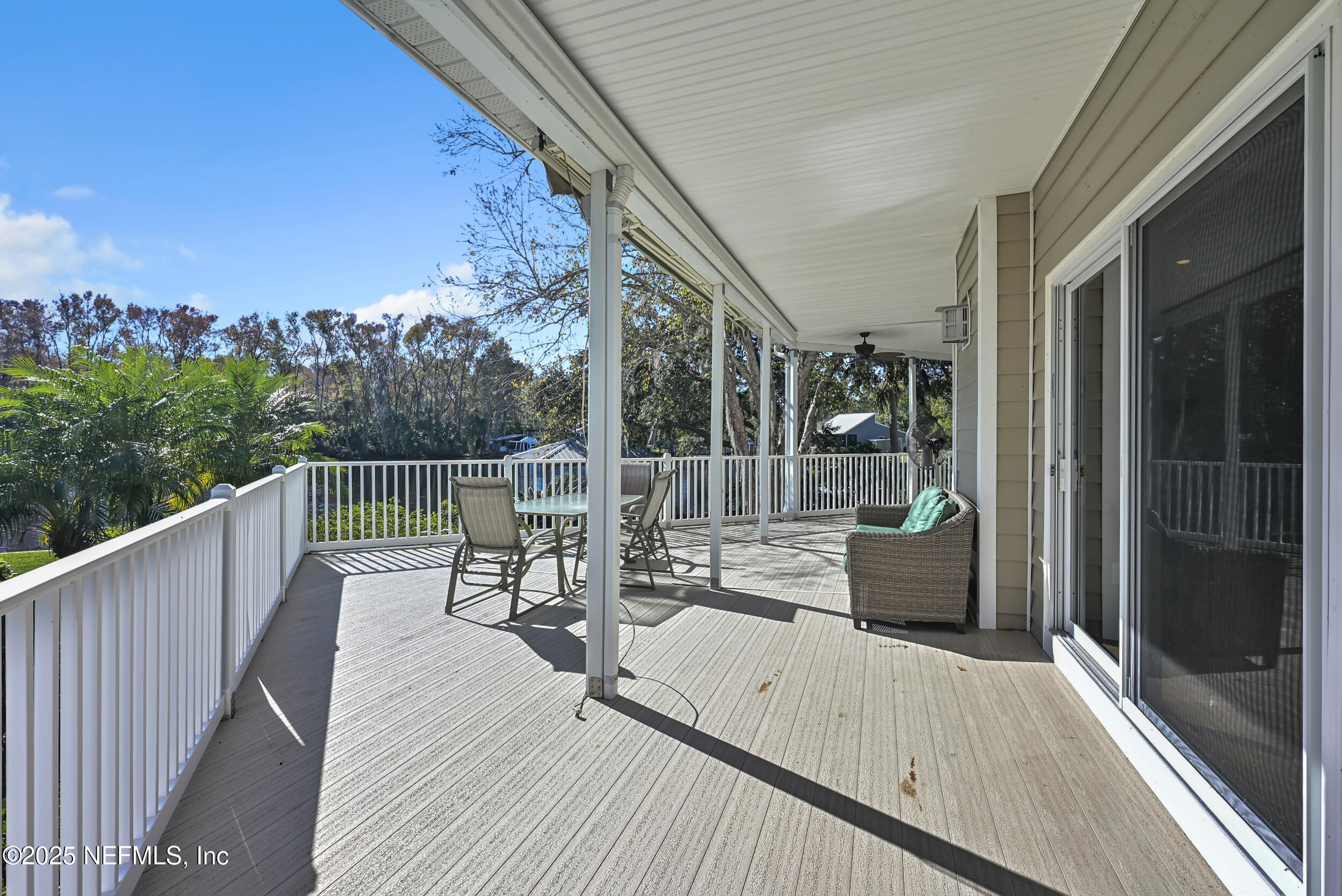 56633 Otter Road Astor, FL 32102 - Photo 53 of 69 a view of balcony with couch and wooden floor