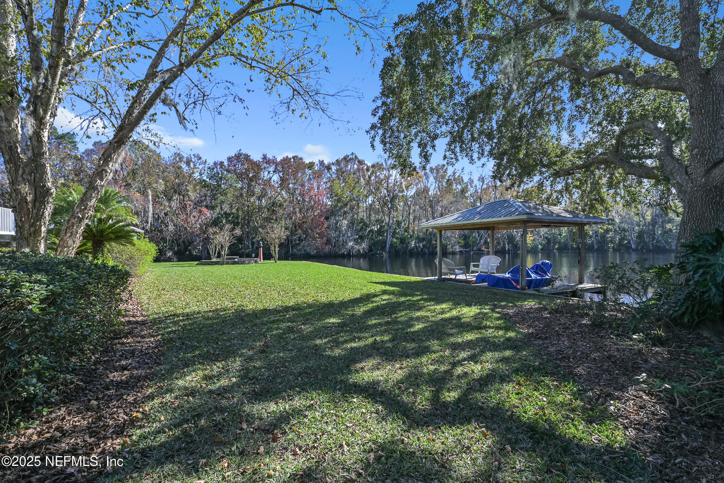 56633 Otter Road Astor, FL 32102 - Photo 56 of 69 a view of a yard with large trees