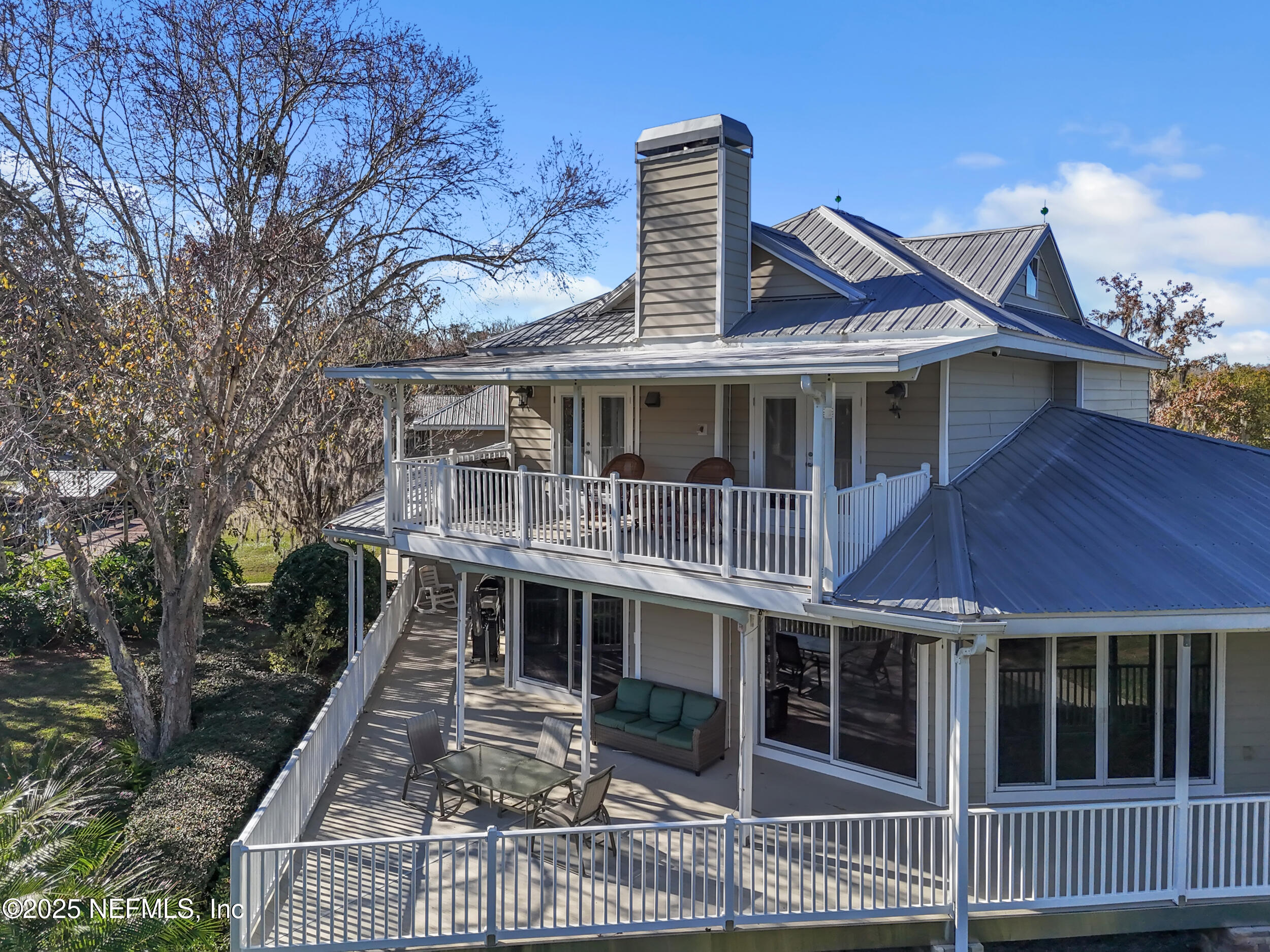 56633 Otter Road Astor, FL 32102 - Photo 58 of 69 a front view of a house with a balcony