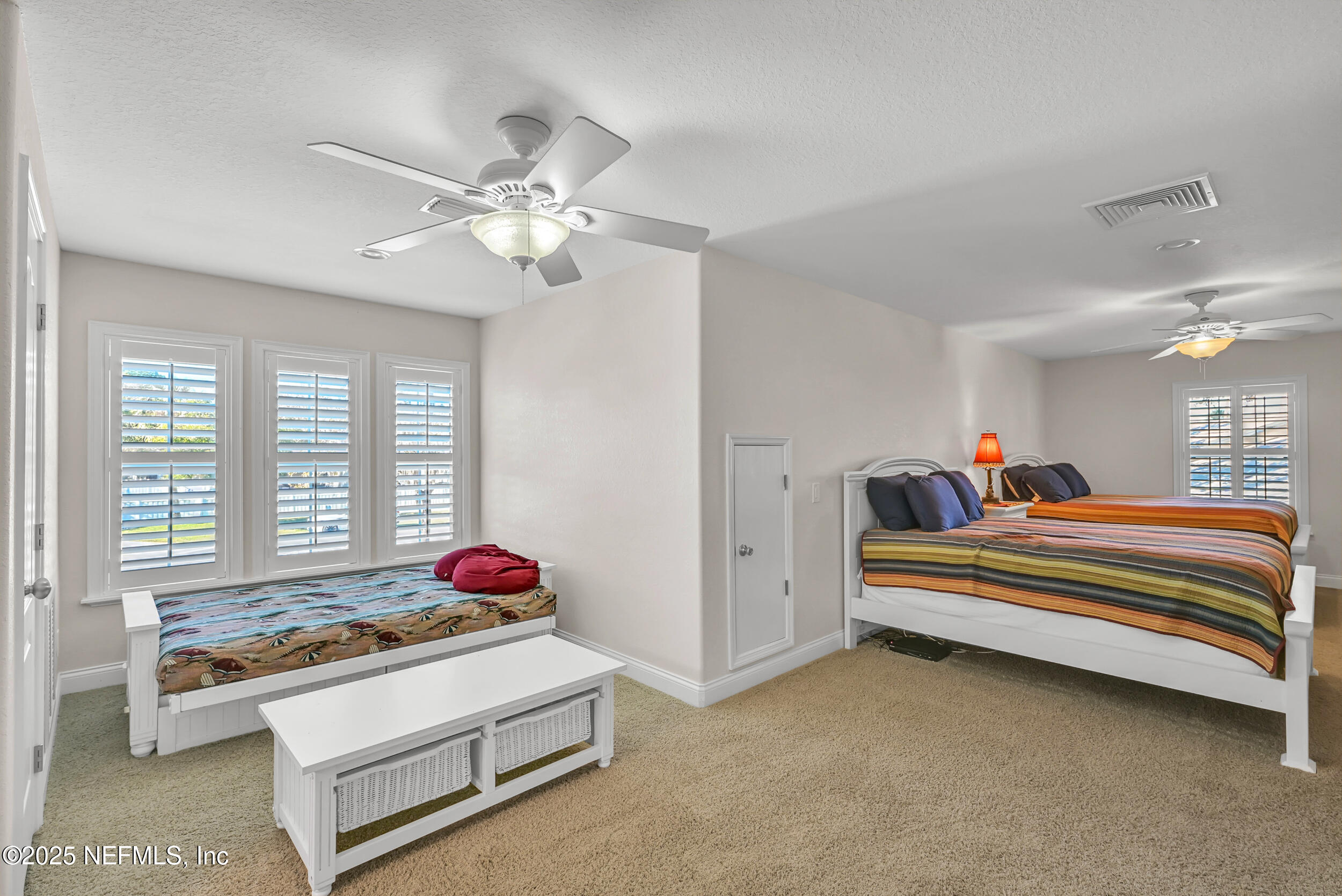 56633 Otter Road Astor, FL 32102 - Photo 62 of 69 a living room with bed furniture and a window