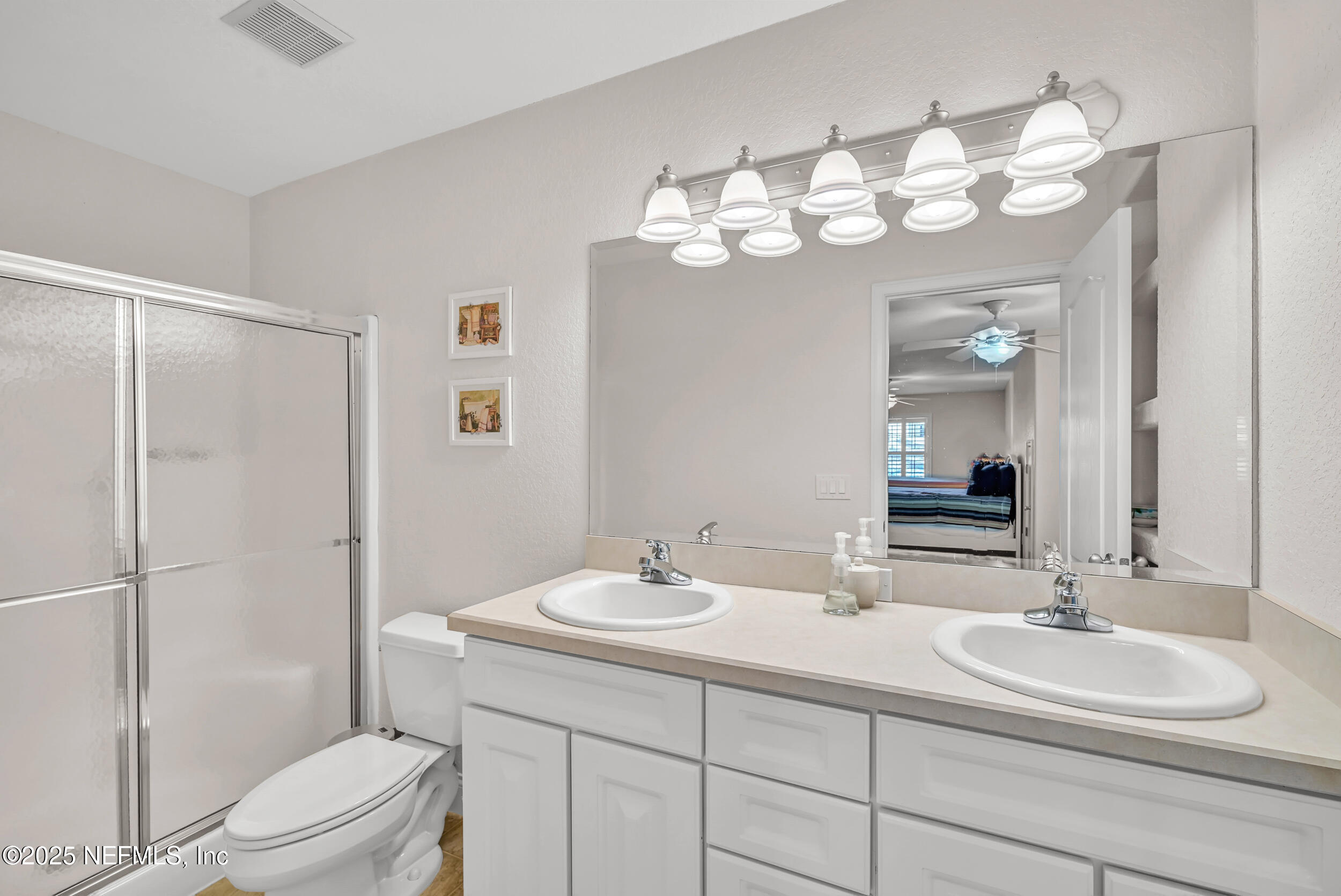 56633 Otter Road Astor, FL 32102 - Photo 64 of 69 a bathroom with a sink a toilet and a mirror