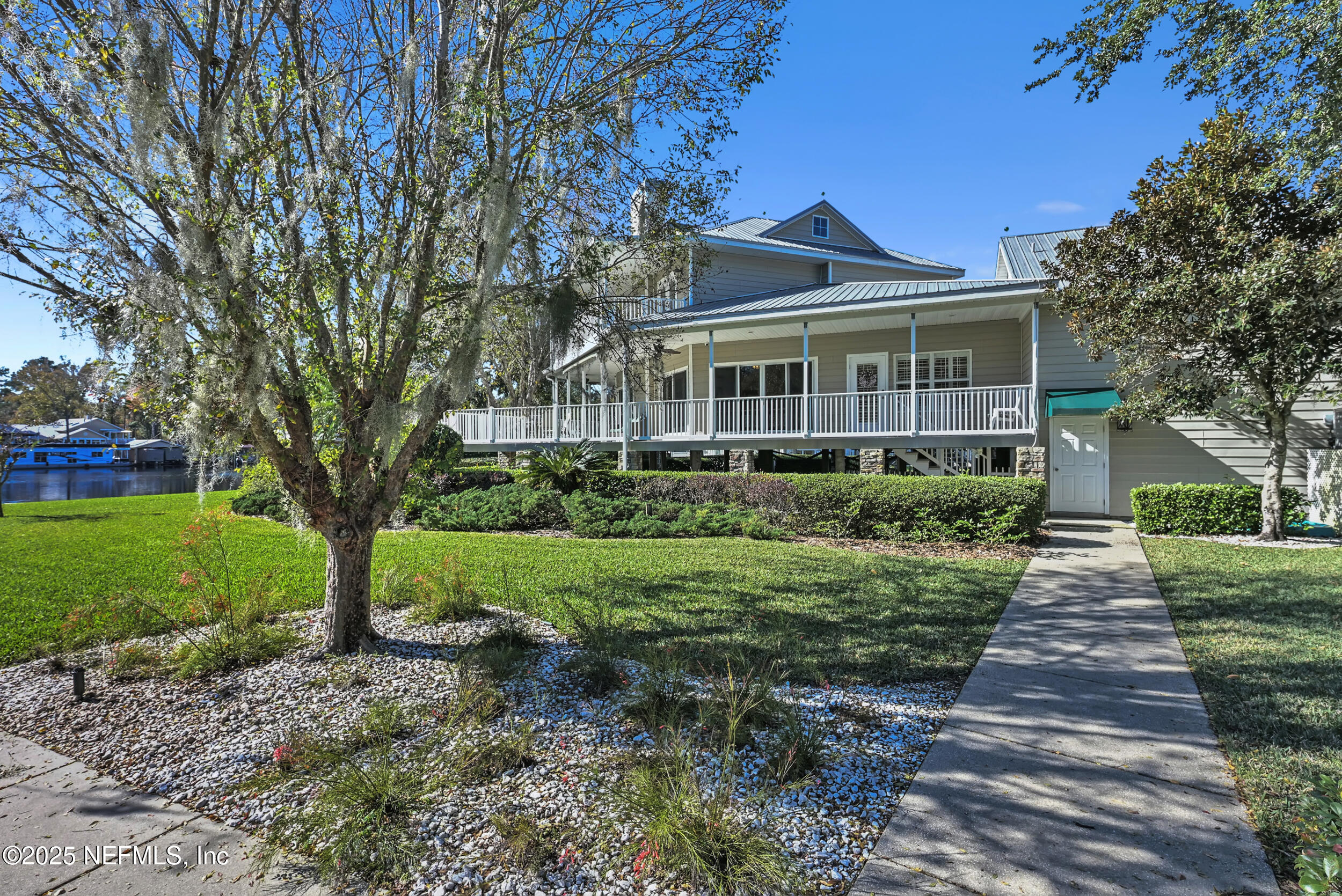 56633 Otter Road Astor, FL 32102 - Photo 67 of 69 a front view of a house with a yard