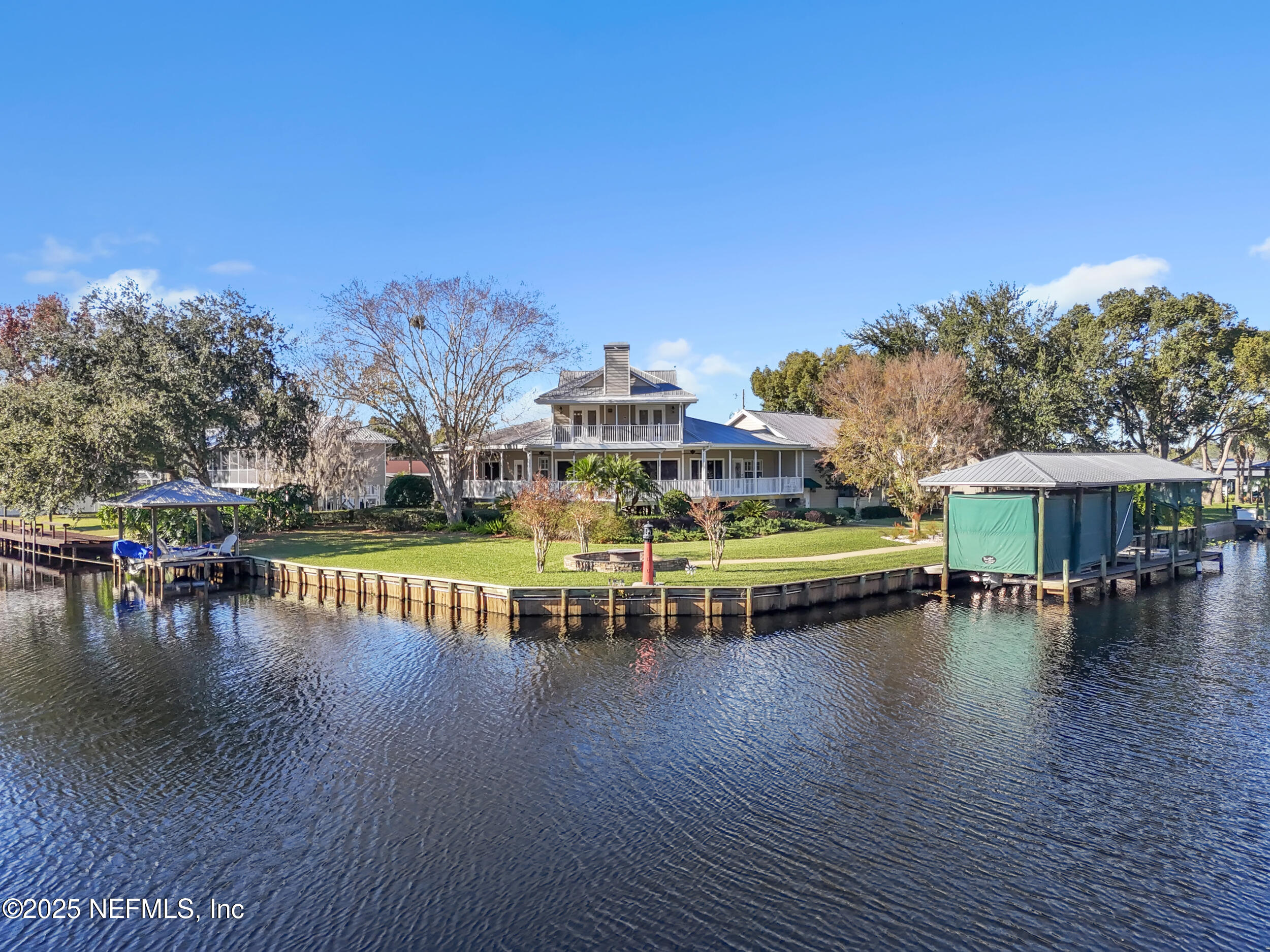 56633 Otter Road Astor, FL 32102 - Photo 69 of 69 a view of a swimming pool with a table and chairs