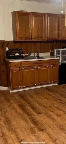 a kitchen with a sink and cabinets