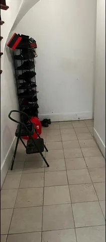 a view of entryway with wooden cabinets