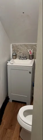 a bathroom with a toilet and a sink