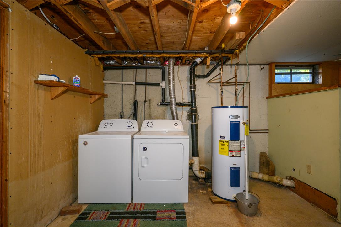 1644 9th Street Bethlehem, PA 18020 - Photo 18 of 27 Functional basement laundry area features washer, dryer, and water heater.