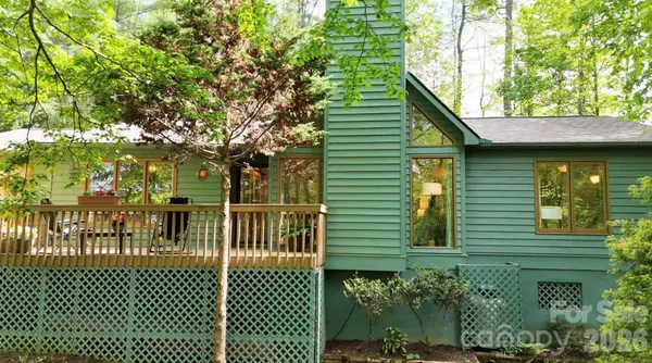 a backyard of a house with yard and outdoor seating