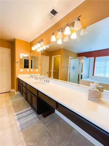 a large bathroom with a large tub and sink