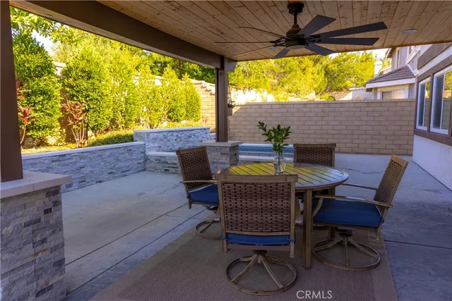a view of an outdoor sitting area with furniture and backyard