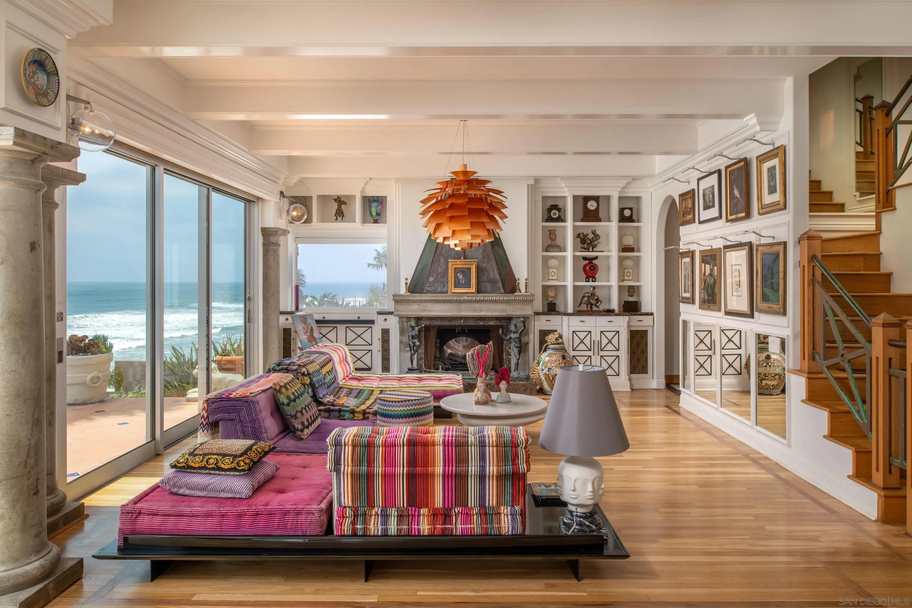 5143 Shore Drive Carlsbad, CA 92008 - Photo 29 of 66 a living room with furniture fireplace and wooden floor