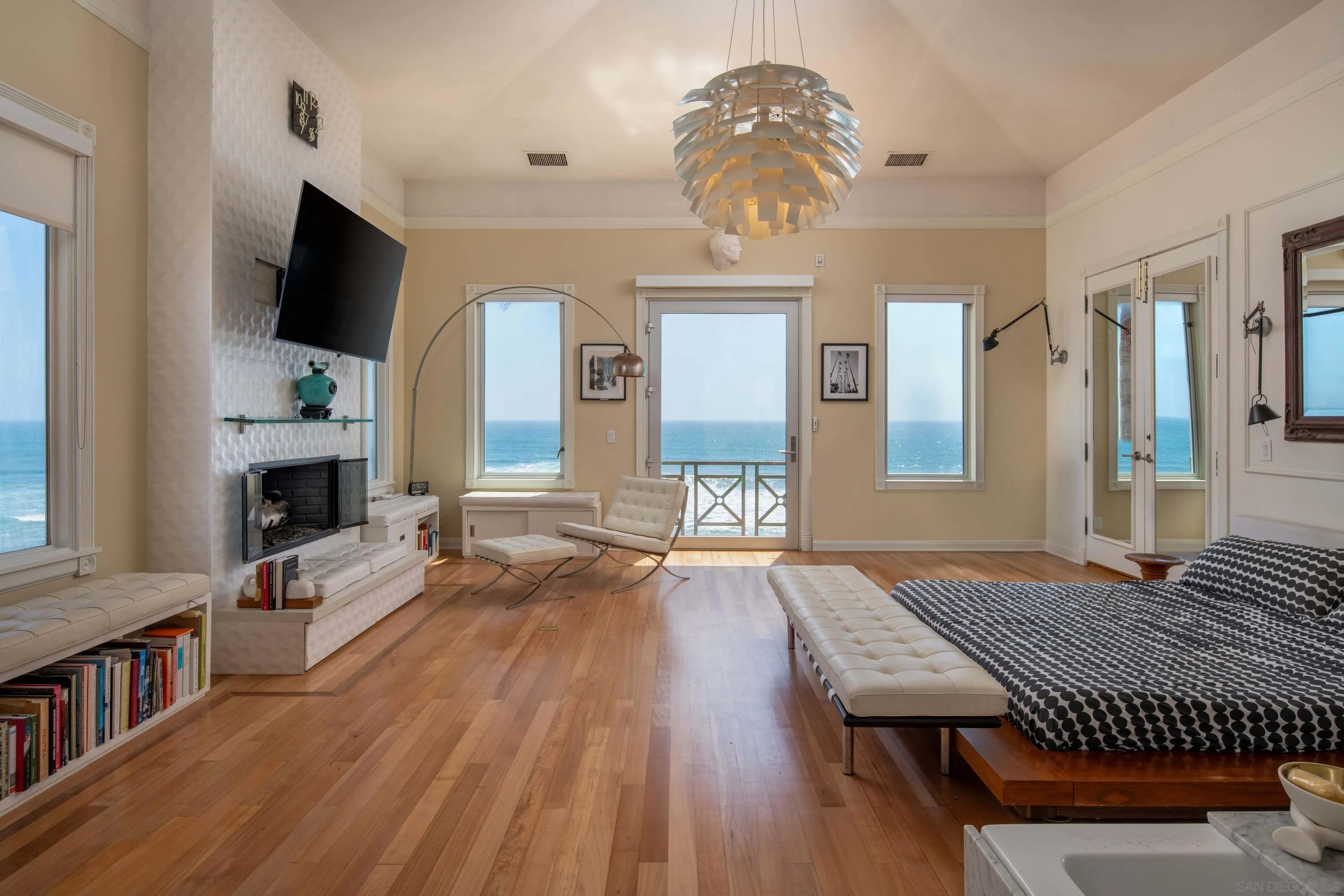 5143 Shore Drive Carlsbad, CA 92008 - Photo 30 of 66 a living room with furniture fireplace and flat screen tv