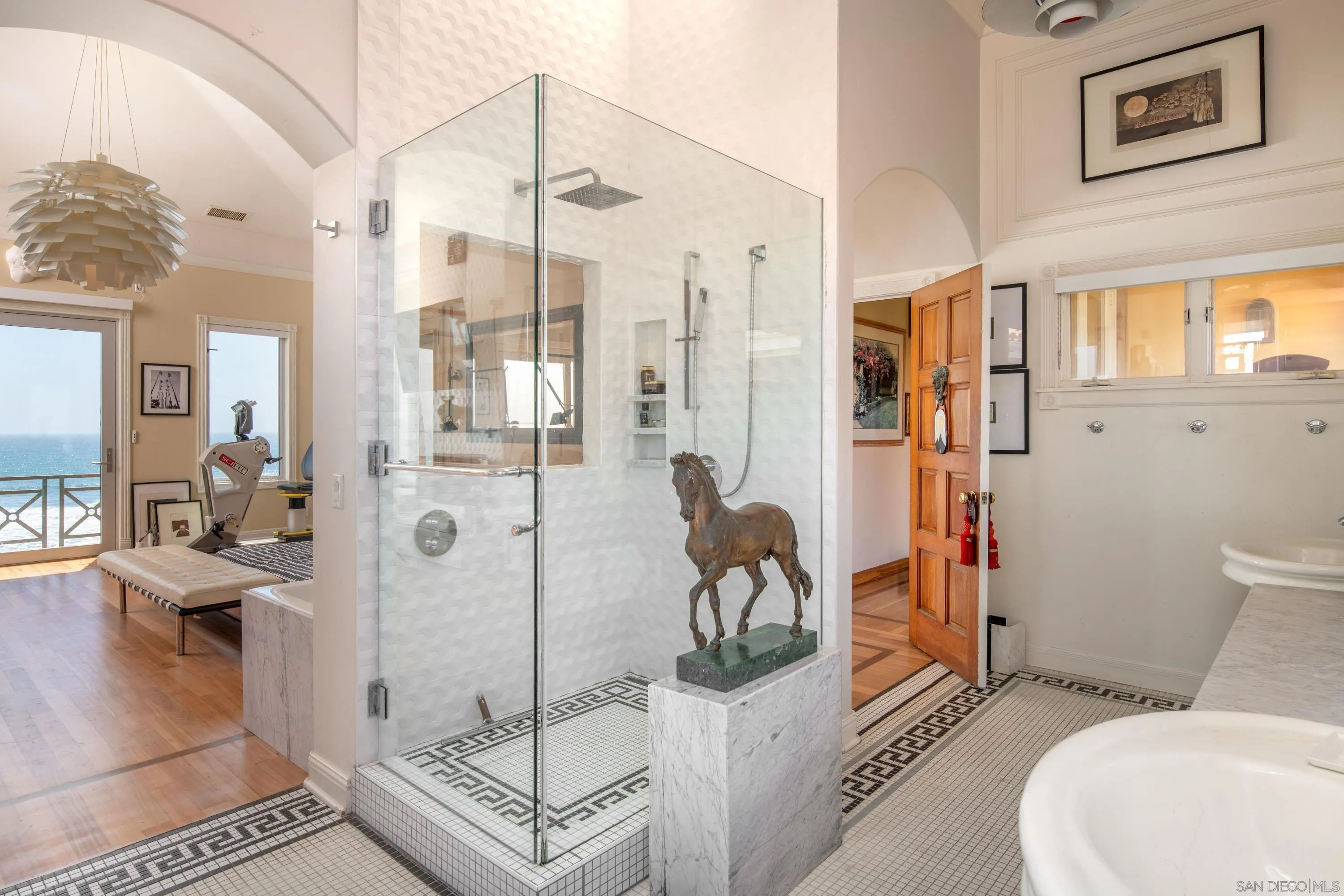 5143 Shore Drive Carlsbad, CA 92008 - Photo 39 of 66 a bathroom with a toilet tub and shower