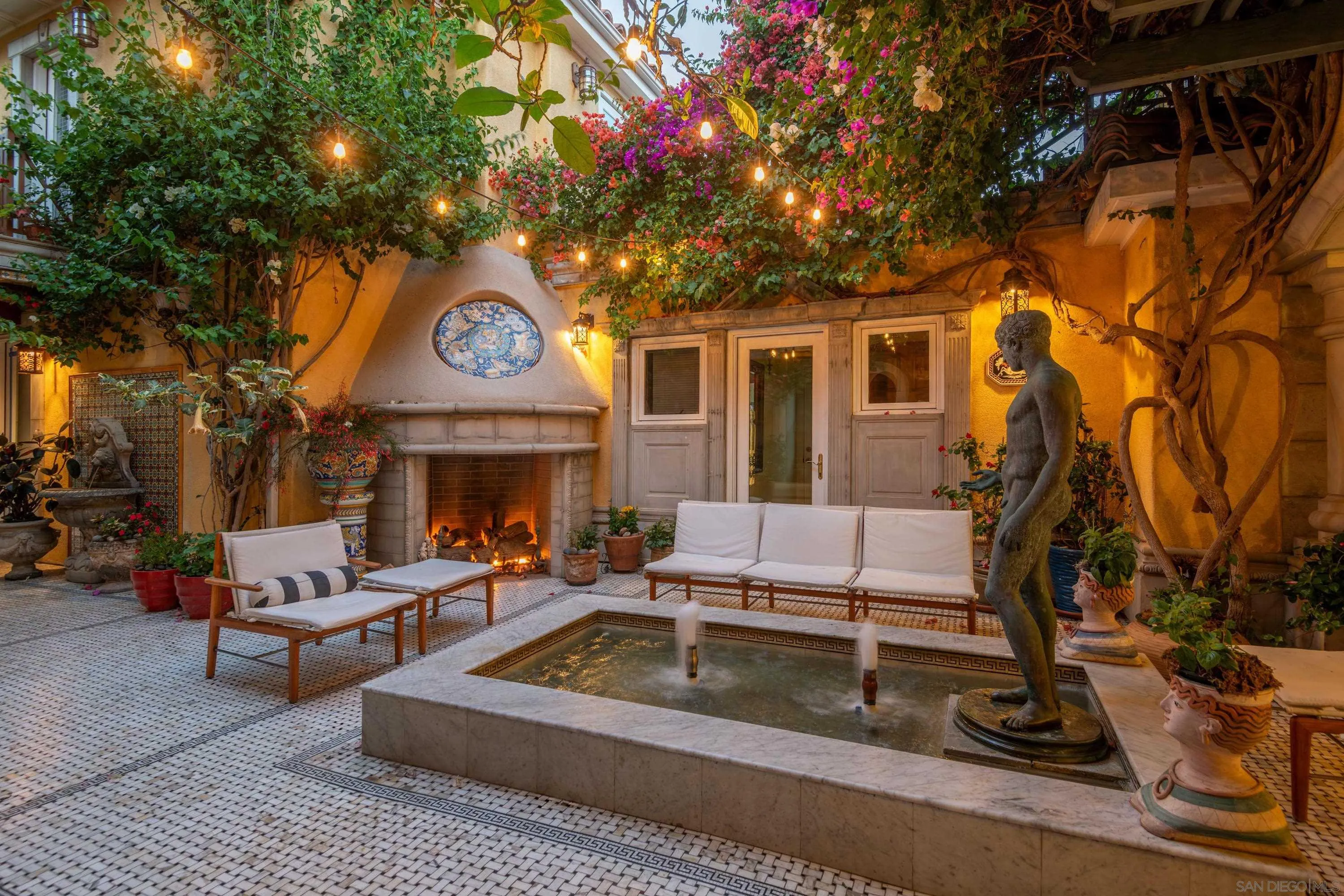 5143 Shore Drive Carlsbad, CA 92008 - Photo 45 of 66 a view of a house with a large tree and couches