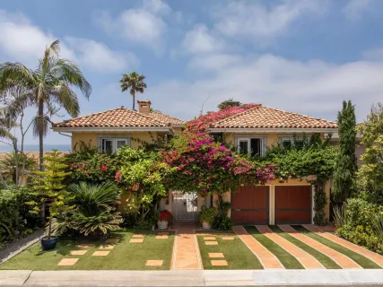a view of a patio with table and chairs potted plants