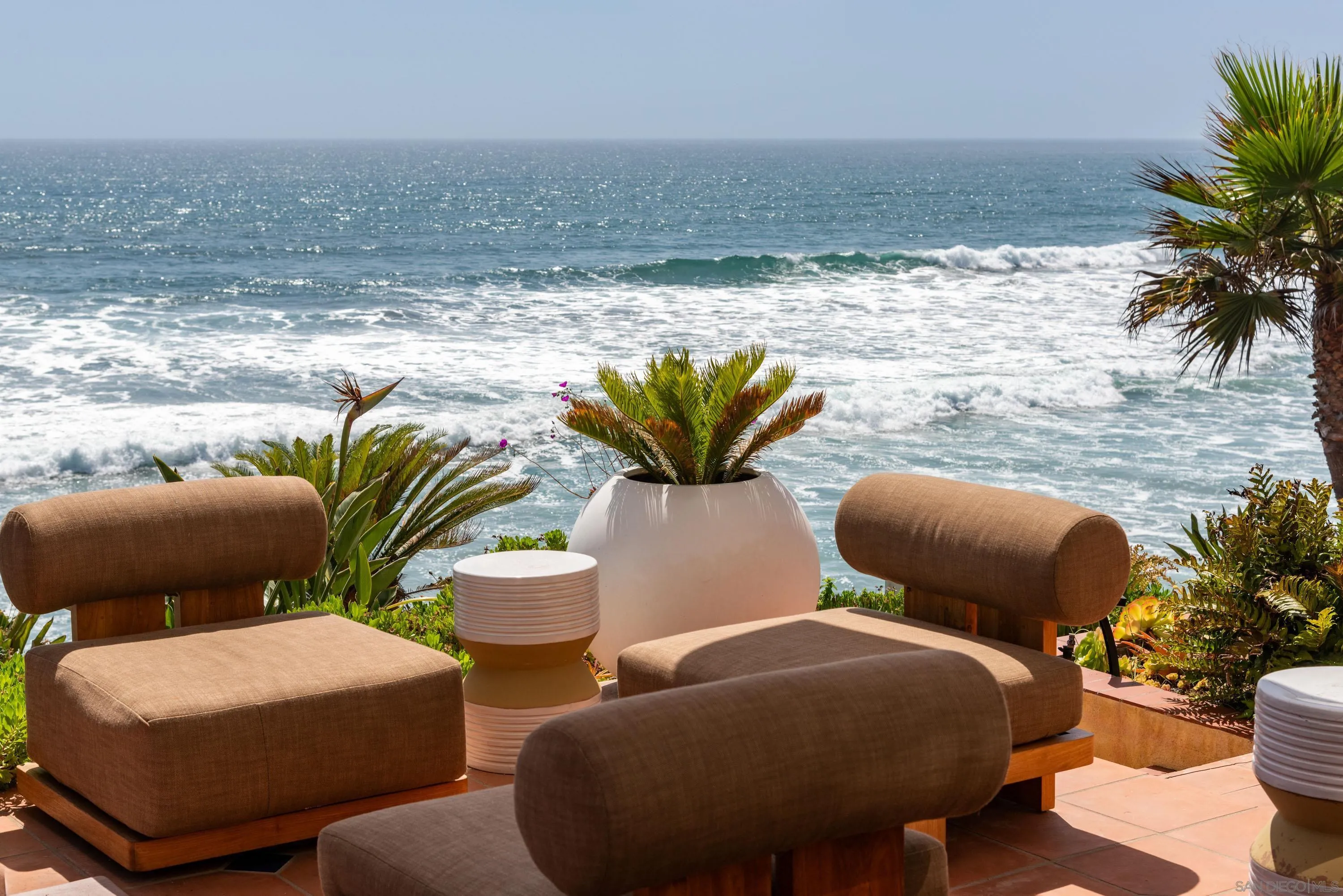 5143 Shore Drive Carlsbad, CA 92008 - Photo 6 of 66 a group of chairs sitting in the middle of a swimming pool