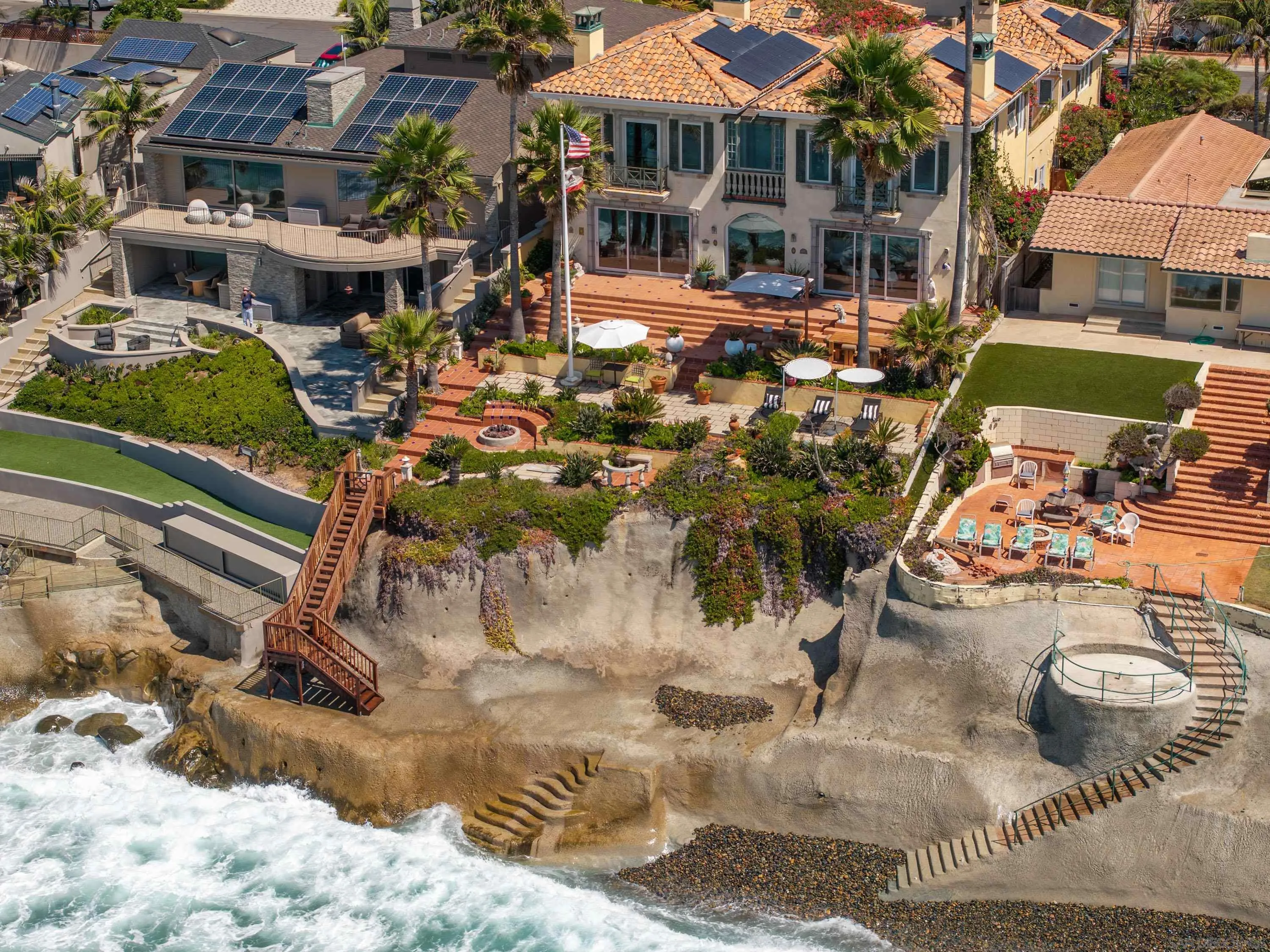 5143 Shore Drive Carlsbad, CA 92008 - Photo 61 of 66 a view of a patio with table and chairs potted plants