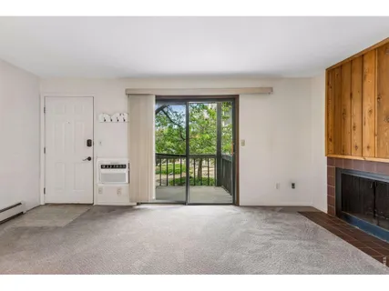 a view of empty room with floor to ceiling window