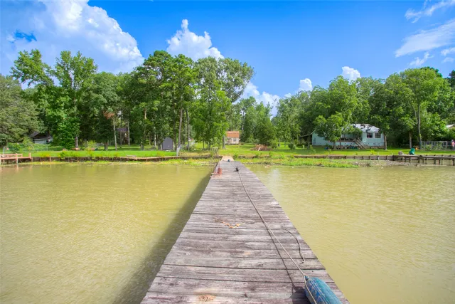 a view of a field with trees in front of it