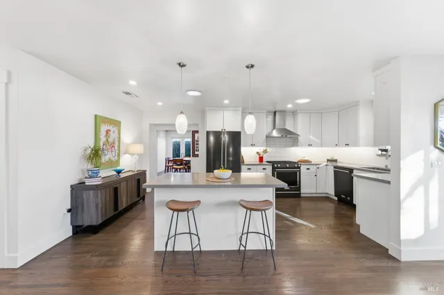 a kitchen with a sink stove and refrigerator