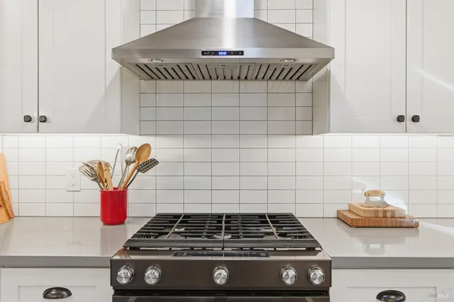 a kitchen with a sink and large window