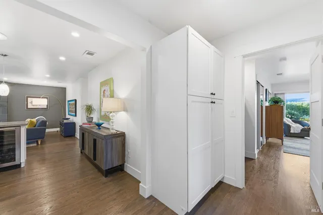 a spacious bedroom with a bed couch and a window
