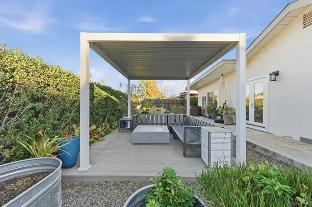 a view of a park with iron fence