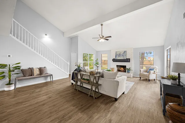 a kitchen with granite countertop white cabinets and stainless steel appliances
