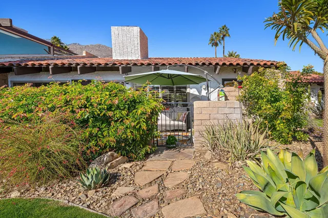 a view of a chairs and table in the patio