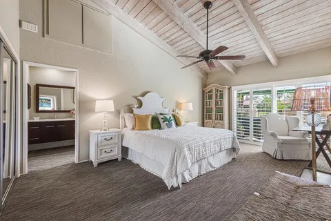 a bed room with a bed and a chandelier