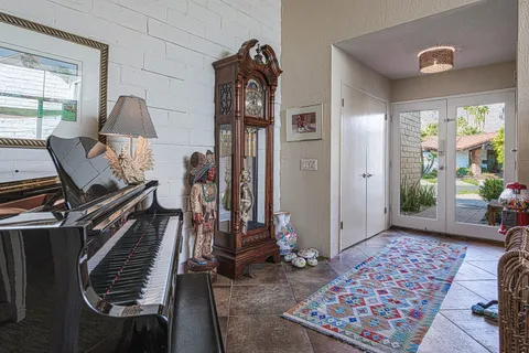 a view of an entryway with wooden floor