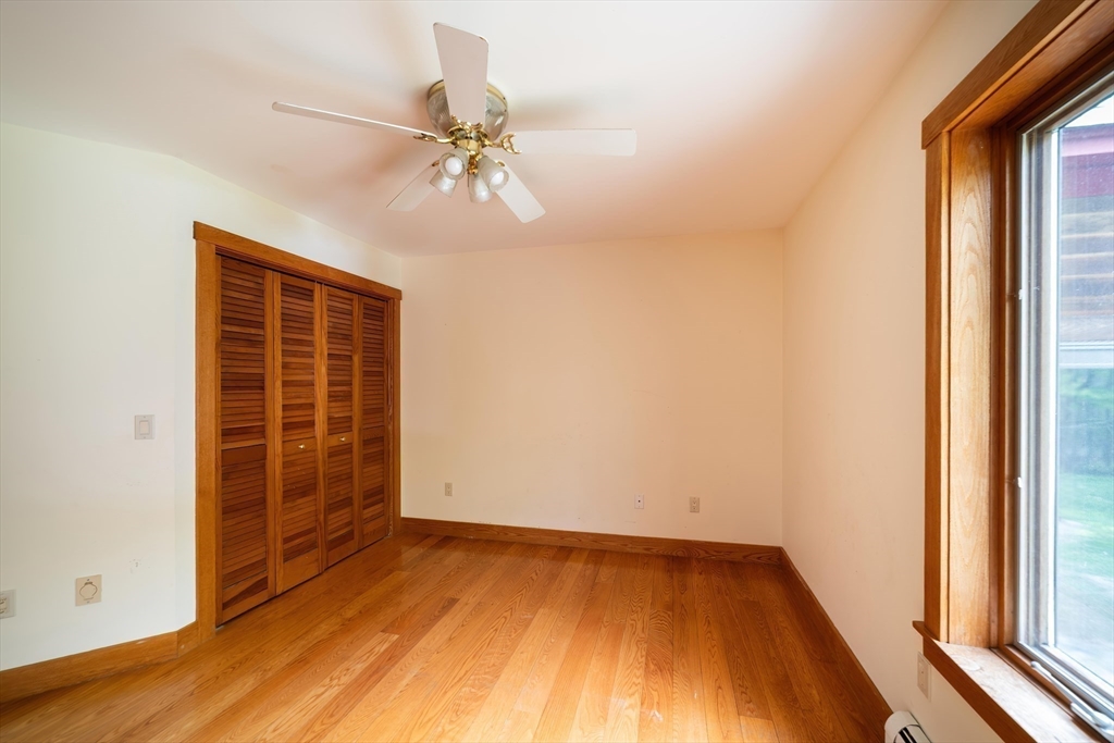184 W Road Bernardston, MA 01337 - Photo 21 of 41 a view of an empty room with wooden floor and a window