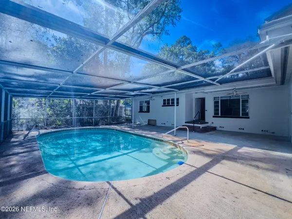 a view of a swimming pool with a patio