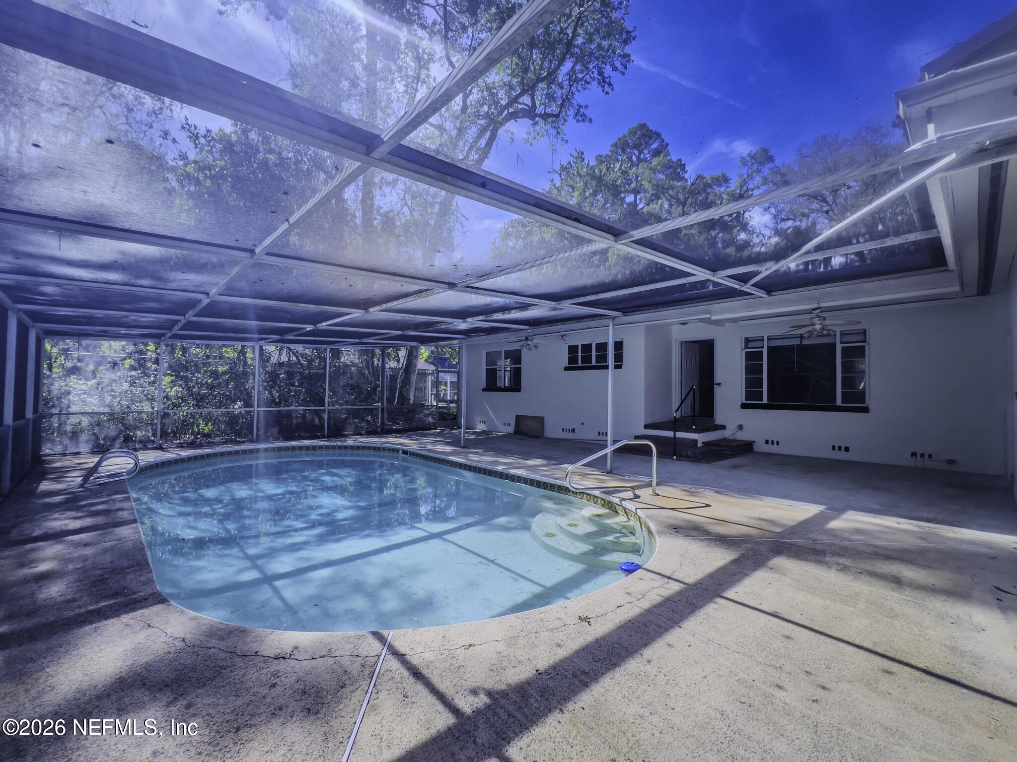 2085 Mills Road Jacksonville, FL 32216 - Photo 1 of 13 a view of a swimming pool with a patio