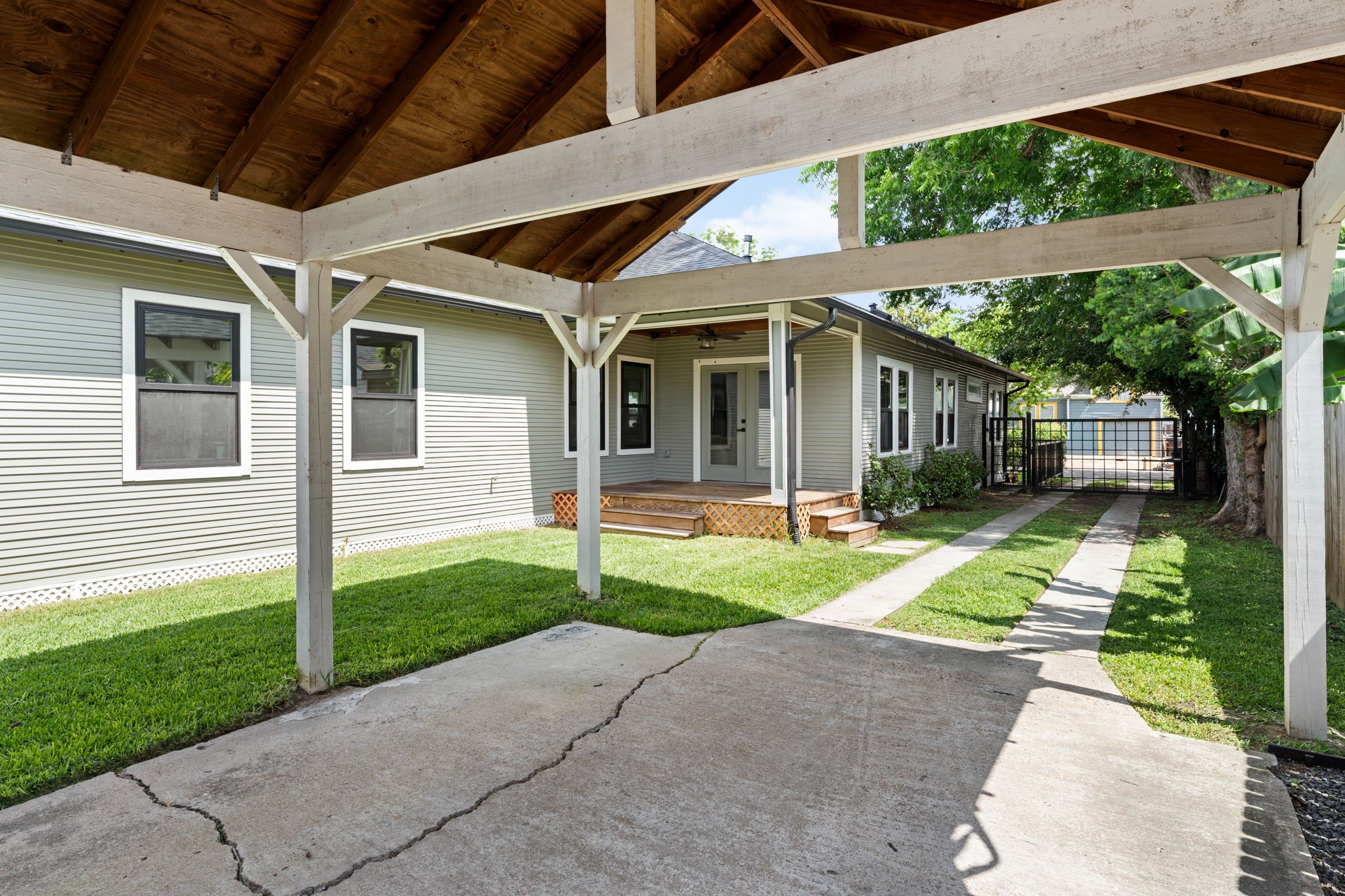 1022 Key Street Houston, TX 77009 - Photo 29 of 30 Parking is never a concern here; the property features a long, gated driveway offering an abundance of secure space for multiple vehicles.