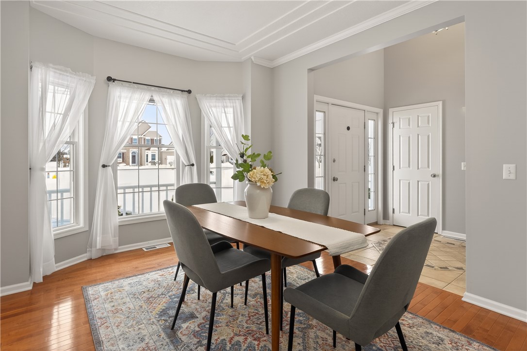 133 Blue Aspen Way Greece, NY 14612 - Photo 15 of 35 A sunlit dining room with a bay window and a thoug