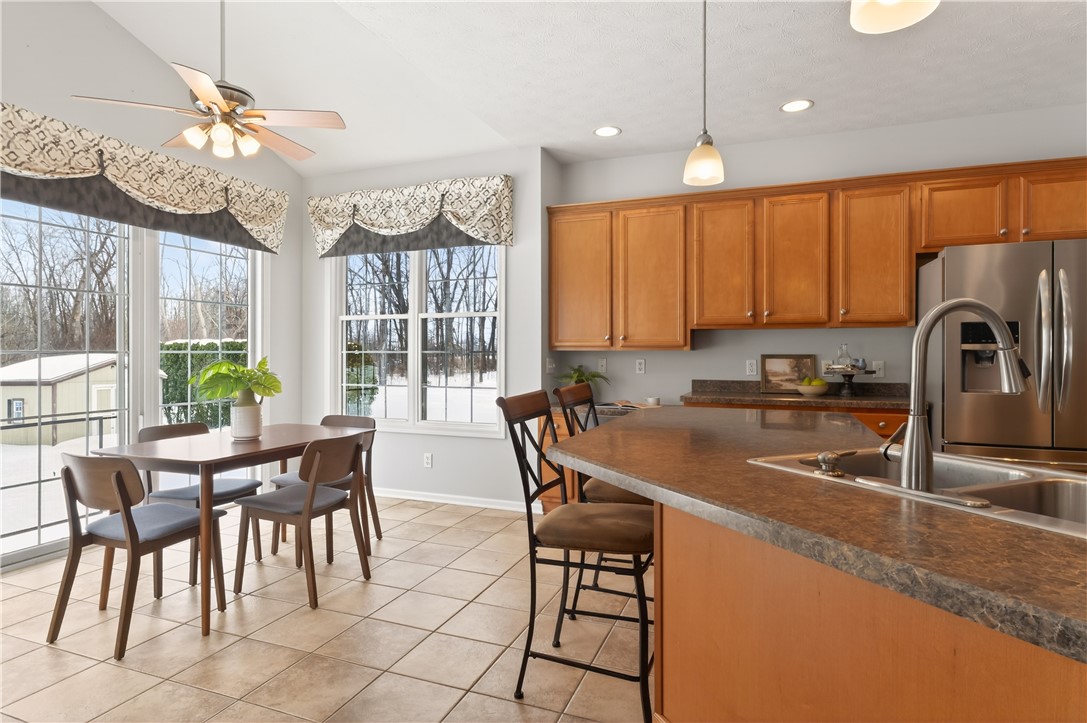 133 Blue Aspen Way Greece, NY 14612 - Photo 9 of 35 With a bright morning room, breakfast bar, and abu