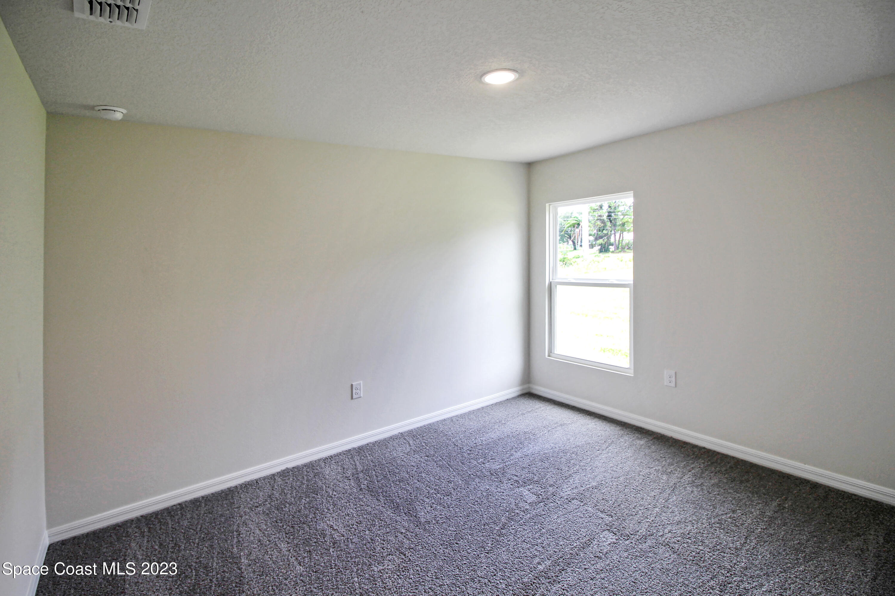 751 Schean Avenue Southwest Palm Bay, FL 32908 - Photo 11 of 12 an empty room with a window