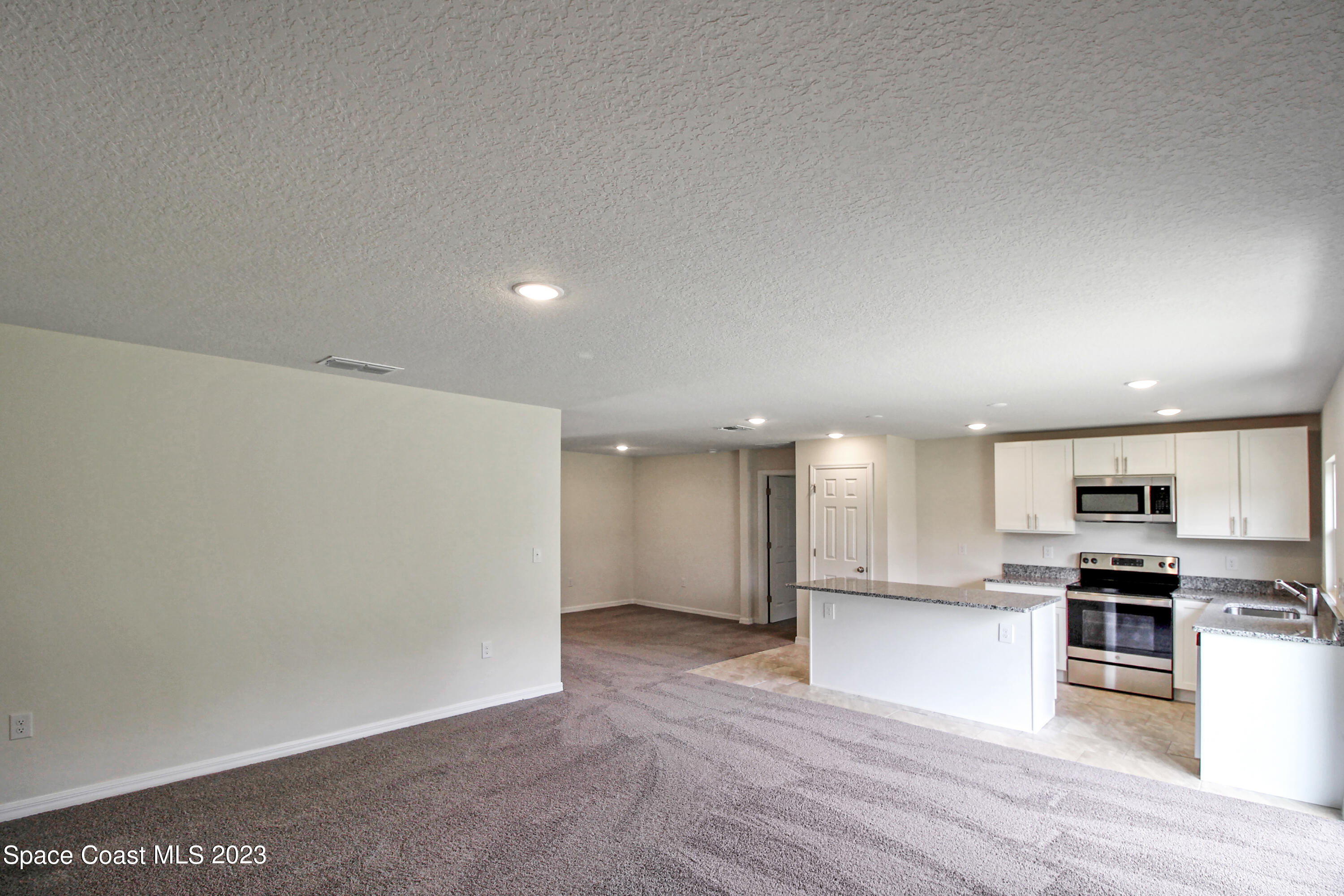 751 Schean Avenue Southwest Palm Bay, FL 32908 - Photo 6 of 12 a view of kitchen with wooden floor