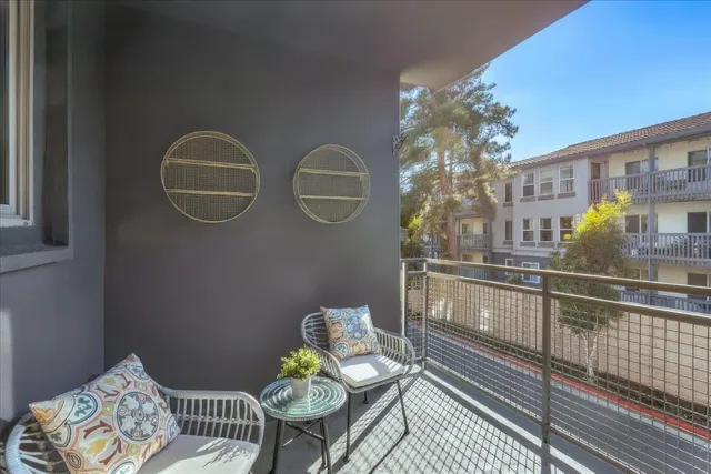 a view of a dining room with furniture wooden floor and chandelier