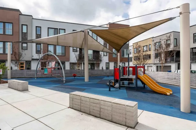 a patio view with a fountain swing table and chairs